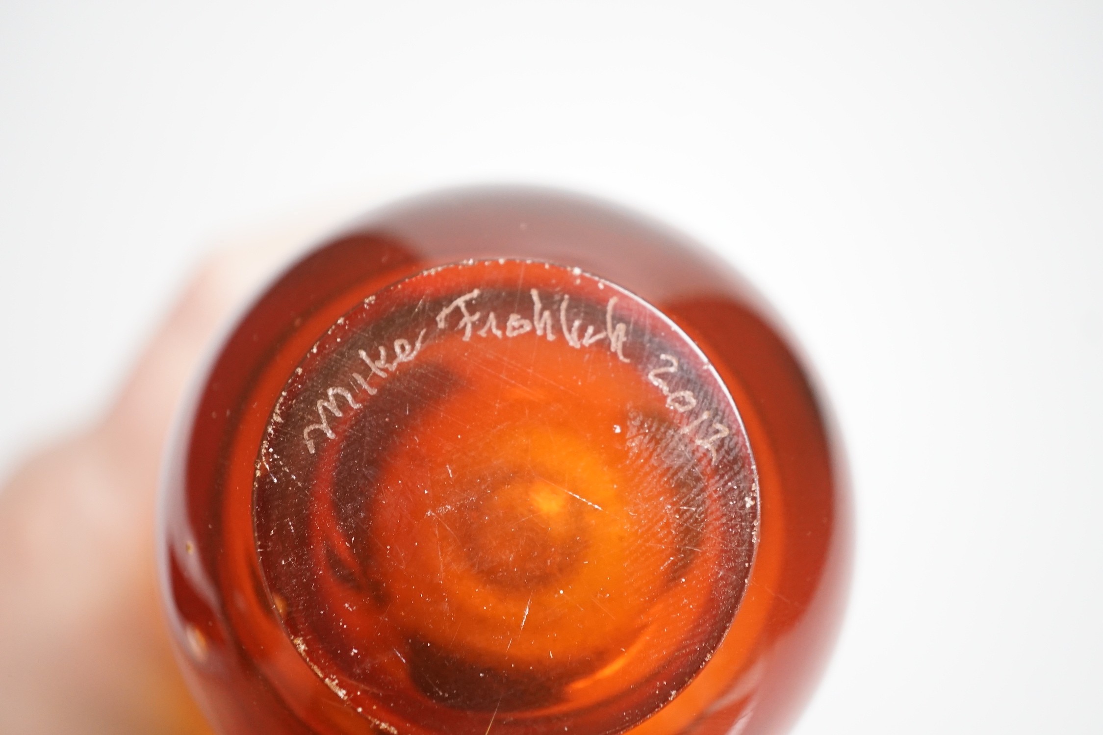 A signed Mike Frolich fused three colour glass vase. 19cm high